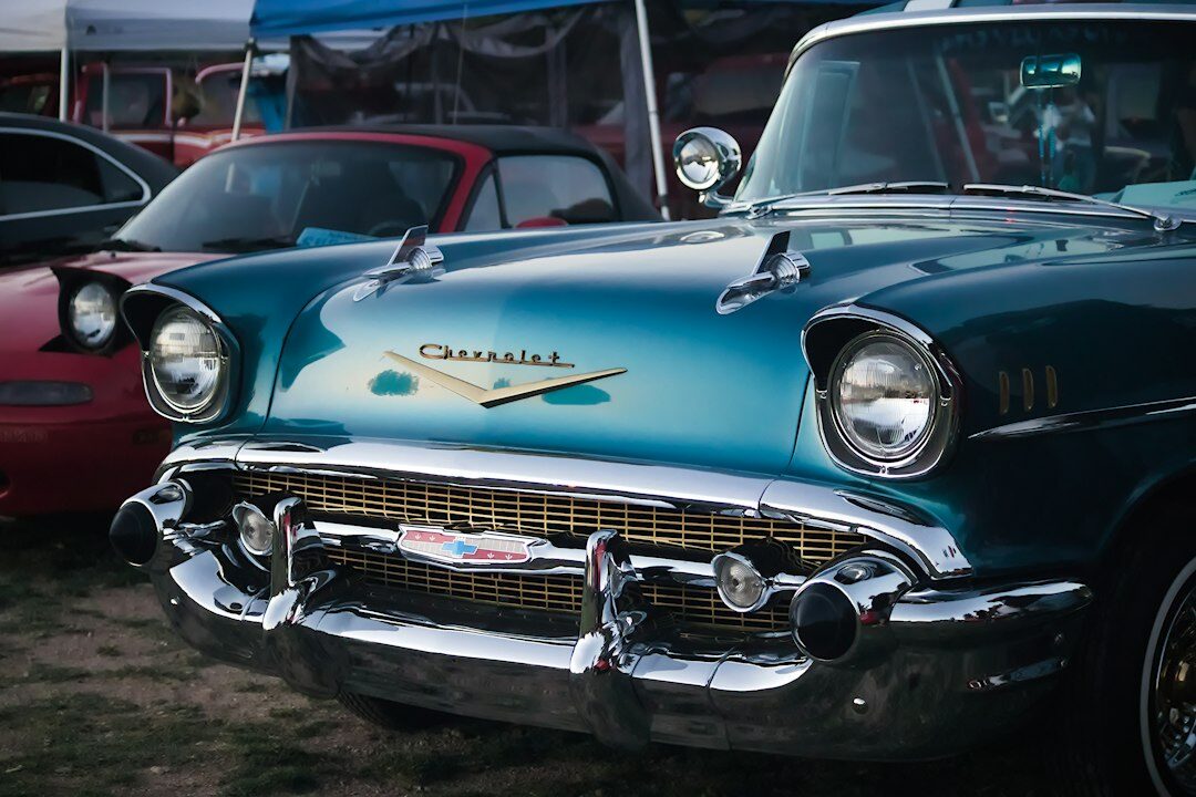 Blue vintage luxury automobile with chrome details on display