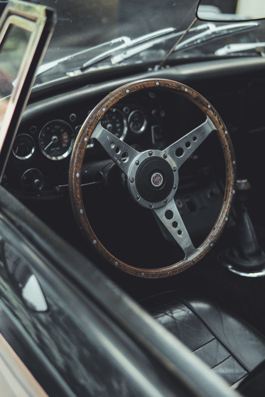 Leather interior and wooden dashboard of a vintage luxury automobile