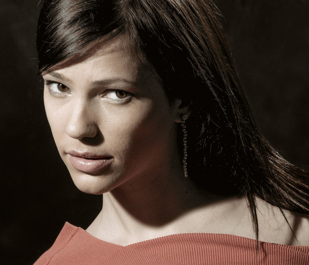 Studio portrait of a Hispanic woman in her thirties with dark hair