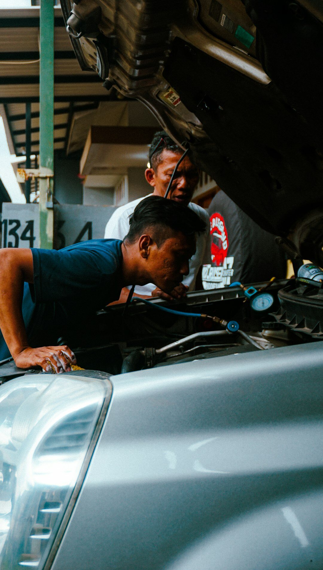 person inspecting car